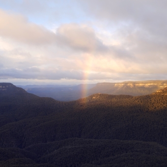 The Valley Pot Of Gold, Echo Point, Katoomba, with the end of a rainbow in the middle of a deep valley