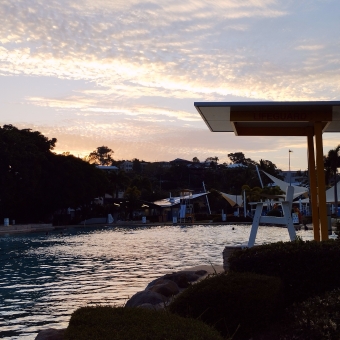 Airlie Lagoon Sunset, with a sunset reflected against the lagoon's water